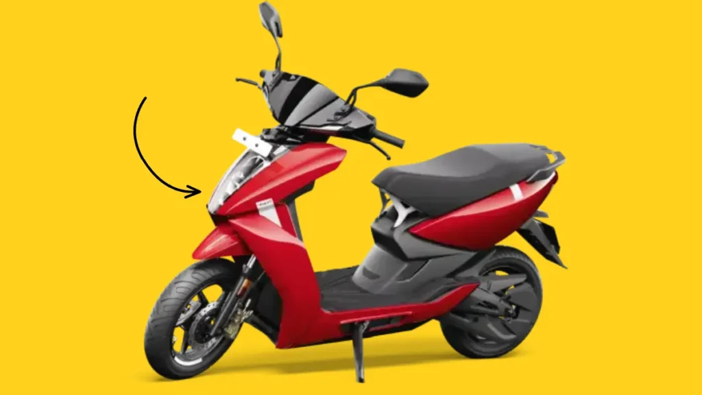 Side view of Ather 450X electric scooter parked outdoors, highlighting its futuristic body, LED lights, and alloy wheels